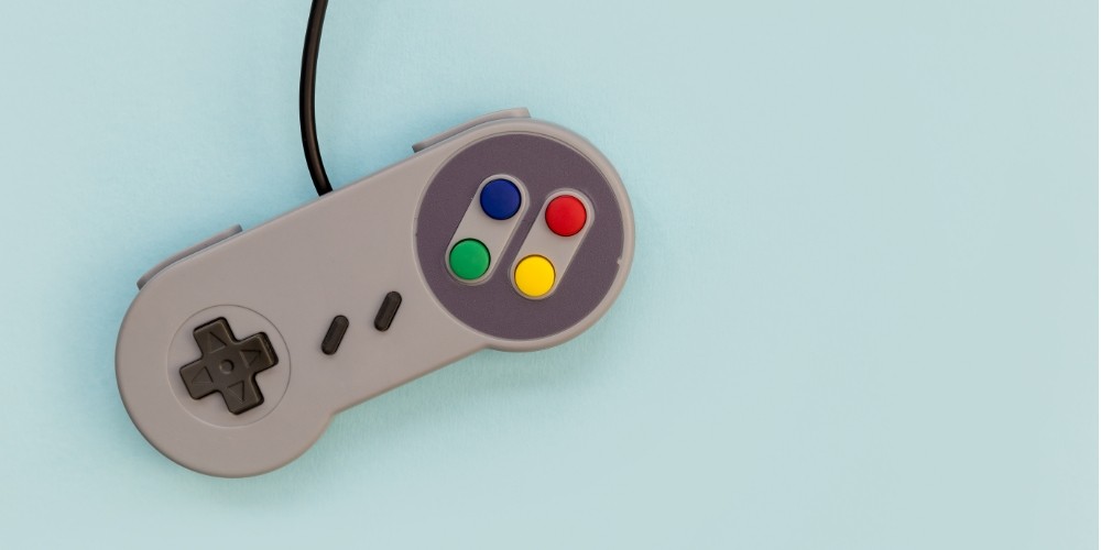 retro-video-game-controller-blue-background