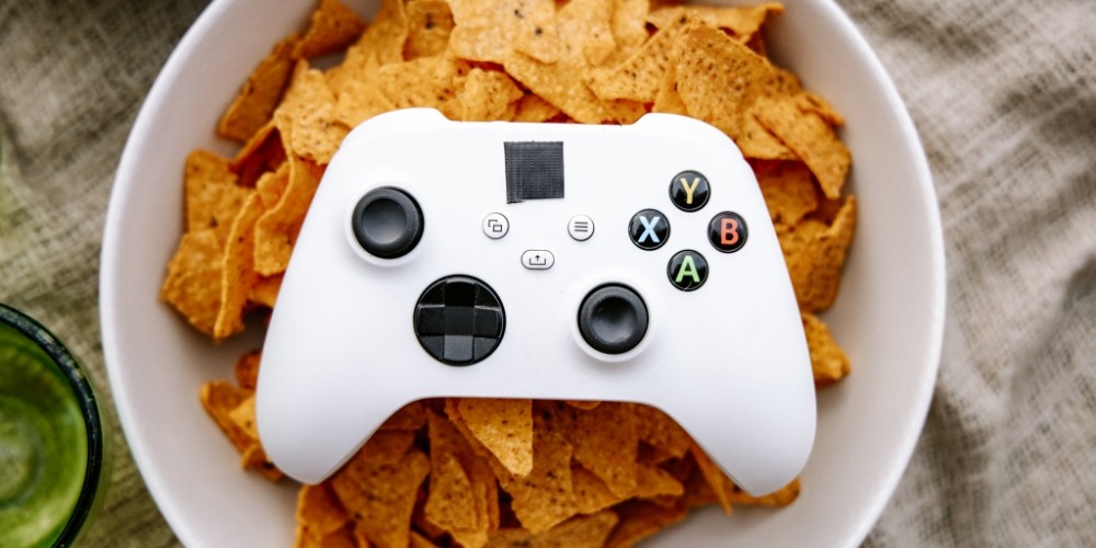 white-game-controller-on-bowl-of-chips